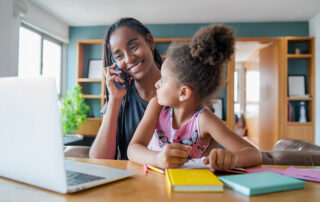 A mother and her daughter discussing online homeschool options.