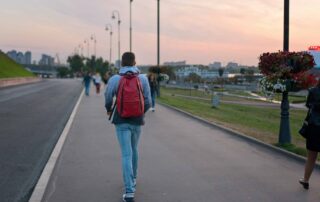 A student walking through to school that doesn't start later.