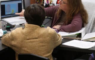 a student in a one-on-one learning environment at The Tenney School.